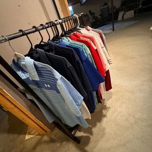 Rack of miscellaneous golf polo’s